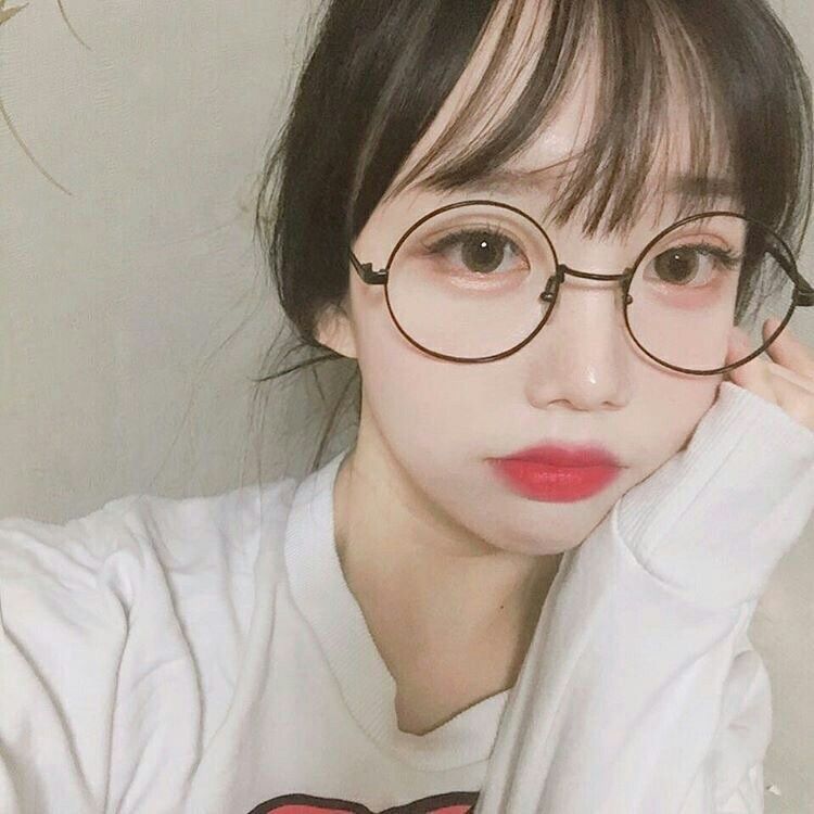 Cute tan asian girl in glasses